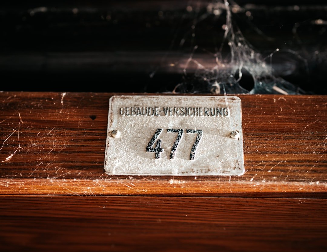 a close up of a wooden table with a sign on it