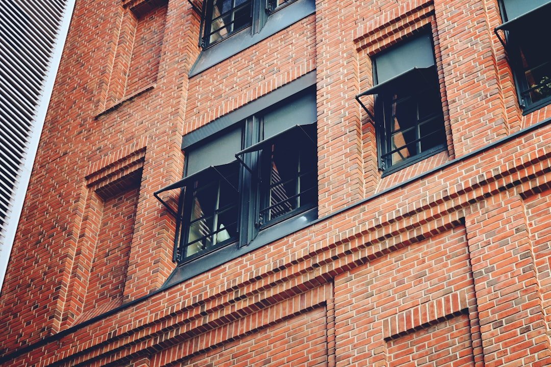 A tall brick building with lots of windows